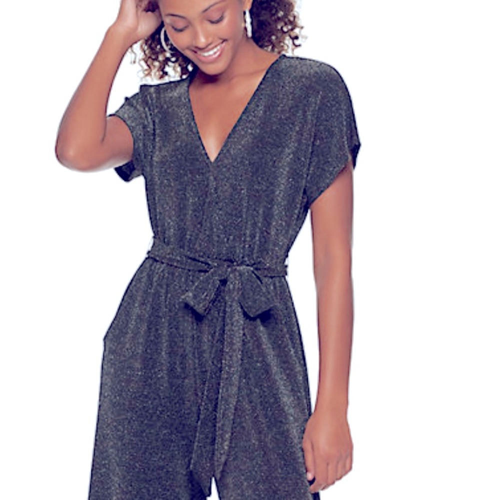 Stand out with this shining glitter of Live To Be Spoiled jumpsuit.